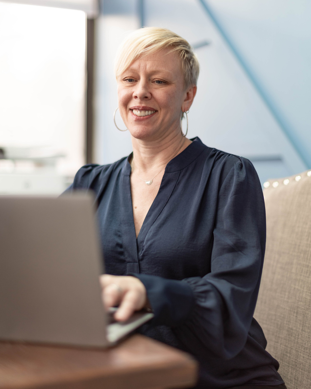 Donna Jean Kendrick on her computer for her weekly Newsletter